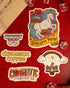 A collection of colorful stickers with unicorn and castle illustrations, branding for Chromatic Coffee, and other related designs laid out on a red surface.